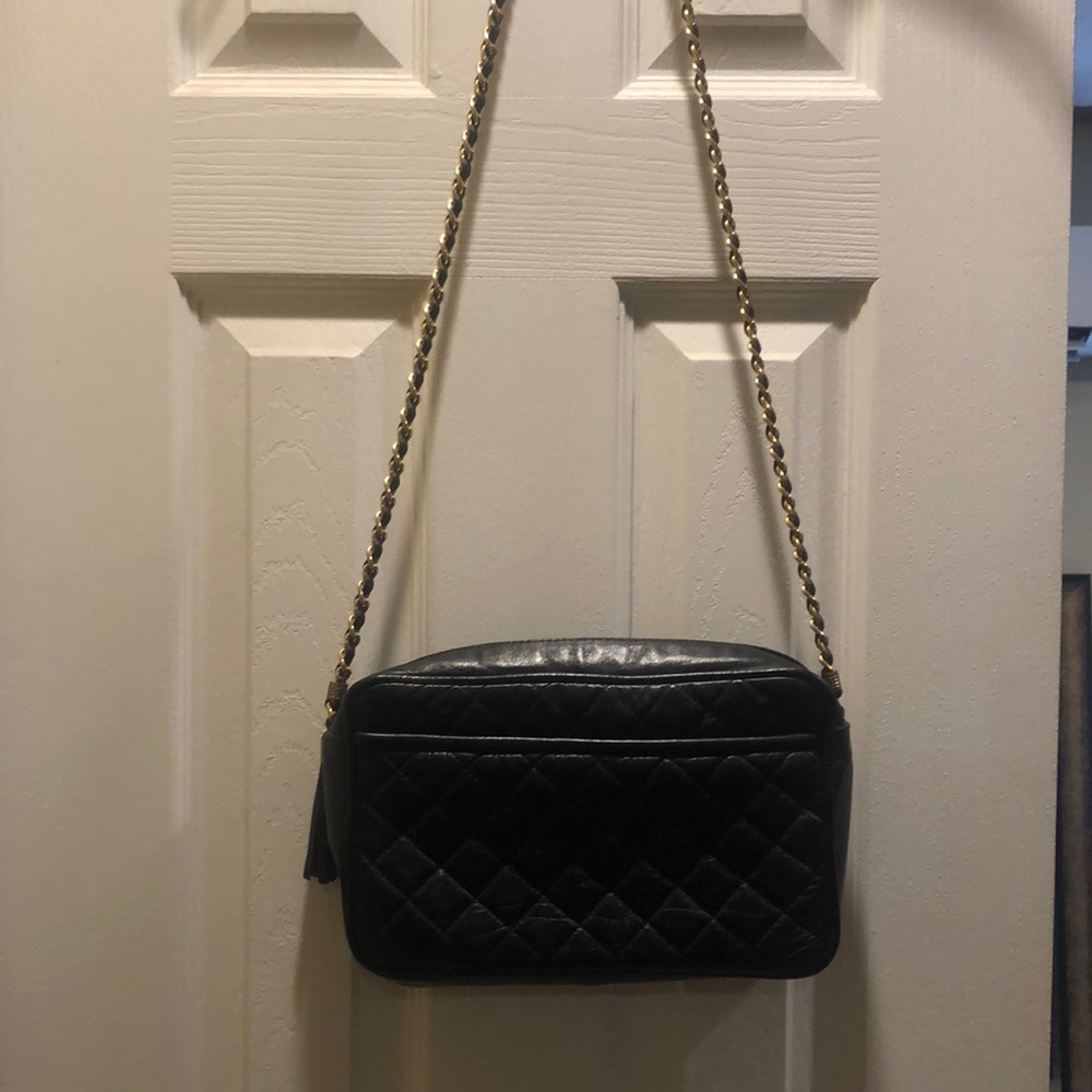 Black quilted bag can be used day or evening. This is synthetic not leather.